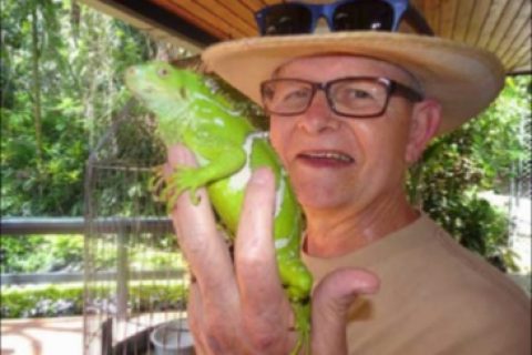 John Birkett holding a chameleon