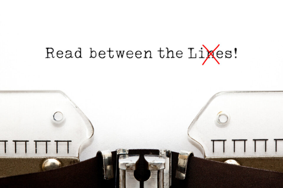 Read Between The Lies Concept On Typewriter