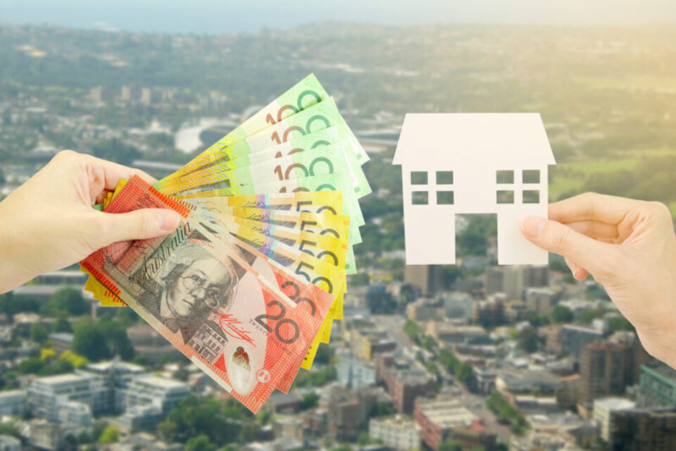 Client giving Australian money to property agent for buying house