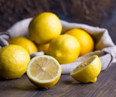 Group of fresh lemon on an old vintage wooden table