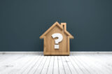 Wooden home icon and  question mark
