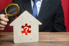 A man examines a house with a missing puzzle inside. Property valuation. Finding problems and structural hidden defects. Checking for compliance with the parameters criteria. Solving housing problems A man examines a house with a missing puzzle inside. Property valuation. Finding problems and structural hidden defects. Checking for compliance with the parameters criteria. Solving housing problems